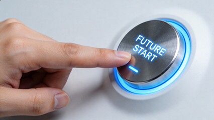 Hand pressing button labeled future start