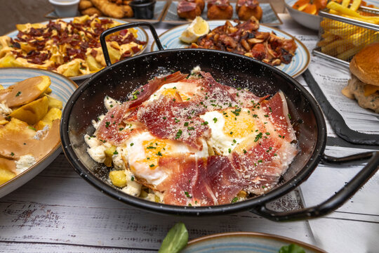 Broken eggs with cooked ham, a milder version, cut into small pieces and mixed with the potatoes and fried eggs