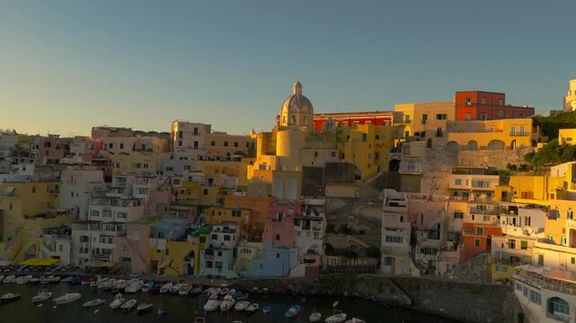 Drone rising around the Santa Maria delle Grazie Incoronata, sunset in Procida, Italy