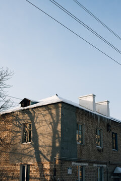 Brick house with a chimney and icicles