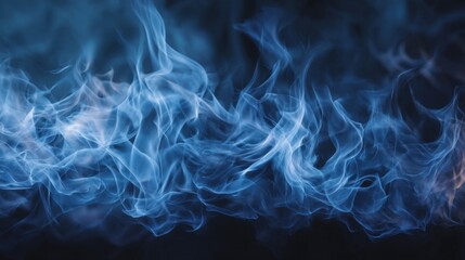 Blue smoke or fog on dark background. Abstract texture motion of gas. Mysterious and ethereal element for design or overlay.