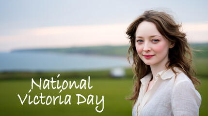 A young woman in her late 20s with long wavy hair stands outdoors in front of a green field and distant coastline under a cloudy sky. National Victoria day concept