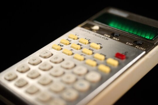 Close-up detail shot of vintage calculator green display