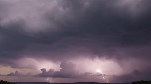 Sheet Lightning Event Broad, diffuse flashes of light illuminating distant cloud masses from within.