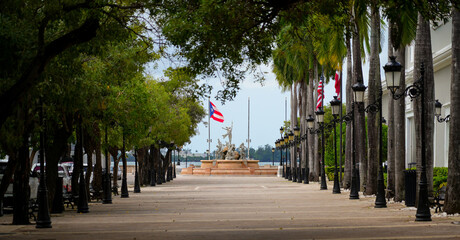 Fototapeta premium The beautiful Paseo de la Princesa walkway leading to the Fuente Raíces (Roots Fountain) in Old San Juan, Puerto Rico