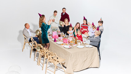 Family applauding child during birthday celebration at home. Concept of emotional family moments, parenting content, kids fashion branding, and lifestyle storytelling for modern families.