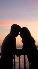 A romantic couple shares a tender moment at sunset by the ocean