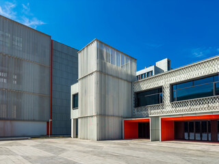 Fototapeta premium Striking Fusion of Modern Architectural Forms and Textures in Bright Daylight