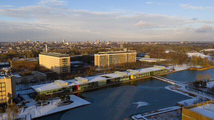 Eindhoven, Netherlands - 04 January 2026: Aerial view of the Philips High Tech Campus, its modern architecture reflecting the winter sky over the partially frozen waters.