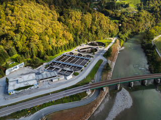 Aerial view of a wastewater treatment facility with circular tanks and filtration systems for clean water and environmental protection.