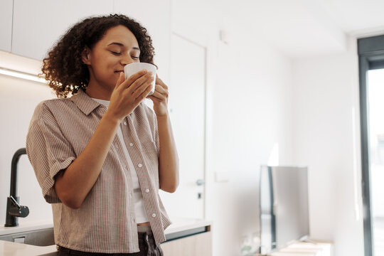 Calm Aromatic Ritual, Tranquil Woman Relaxes With Fragrant Mug Instructions In Comforting Environment