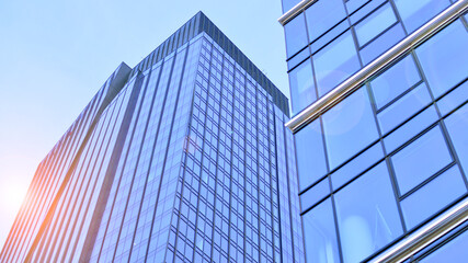 Obraz premium Modern office building exterior made from glass and steel. Windows of office building. Abstract architectural concept with sunlight. 