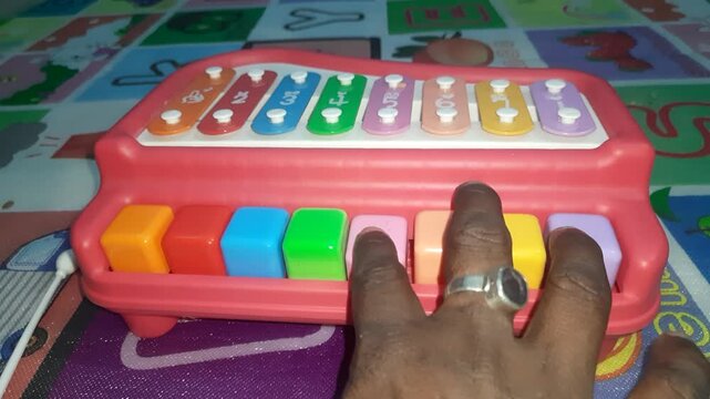 Colorful toy xylophone with piano keyboard base, combining percussion and keys to enhance musical learning, motor skills, creativity, and early sound recognition for kids