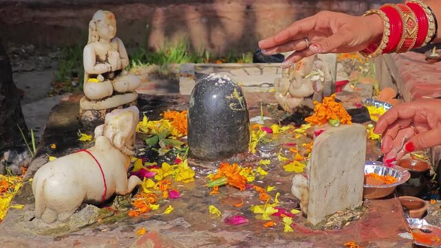 Hindu Shiva altar with offerings and worship
