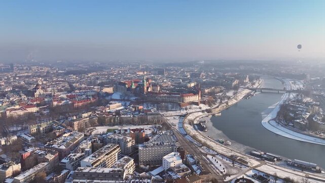 Krakow aerial view over river with castle and city landscape in winter