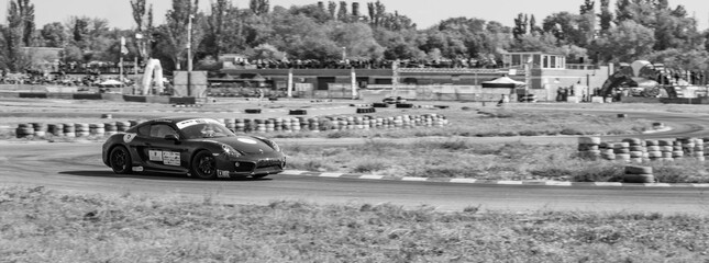 Obraz premium racing car. motorsport. circuit racing. dangerous moments on the track. high vehicle speed. sharp turn. demolition of wheels.