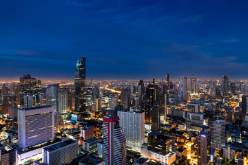 Naklejka premium Modern Bangkok city skyline at night, illuminated skyscrapers, urban lights, Thailand metropolis
