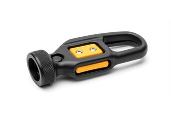 Close-up of a modern black and yellow metal connector part used in machinery or tools, with screws and grip design.
