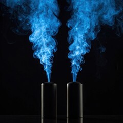 Two dark cylindrical objects emit vibrant blue flames reaching upward in dramatic display