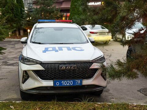 Russian DPS traffic police patrol car based on a JAC crossover parked on a city street with a visible blue police license plate.