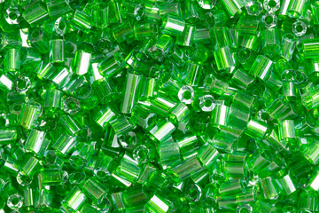 Pile of small transparent green acrylic beads, Top view