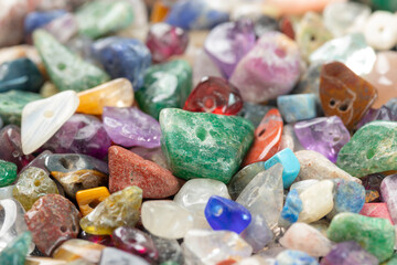 Pile of colorful semi-precious gemstone beads and healing crystals, Close-up