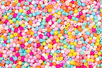 Pile of small colorful round beads for background, Top view
