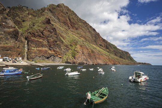 Boat harbour with boats and cliffs, Paul do Mar, Madeira, Portugal