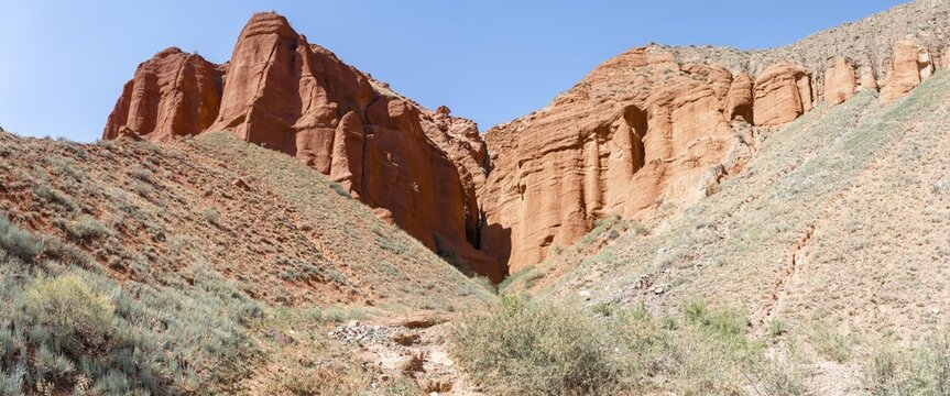 Rock formations of eroded red sandstone, near Konorchek Canyon, Chuy, Kyrgyzstan