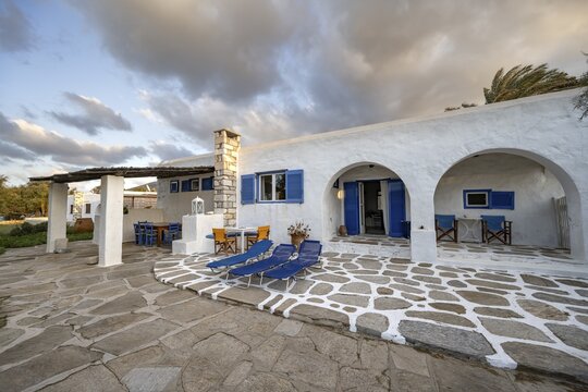 White Cycladic house with terrace with chairs and sun loungers, Holiday home, Parikia, Paros, Cyclades, Greece