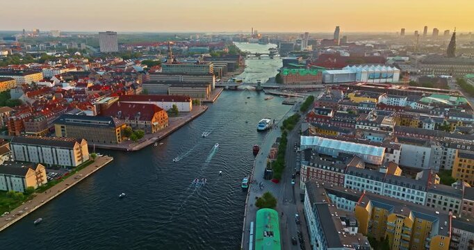 Aerial view of downtown Copenhagen in Denmark atsunset. A view of the embankment and the old part of the city with a church and other landmarks