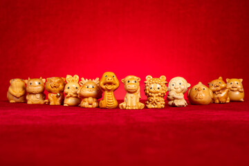 the Chinese Zodiac with the Horse in front on red background at horizontal composition