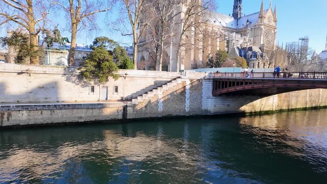 2026 written in fresh snow on stone bench by river