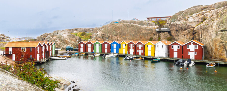 Colorful coastal boathouses along rocky Smogen harbor in Vastra Gotalands Ian, Sweden