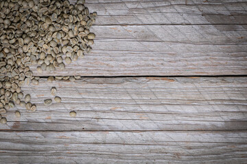 Rustic Wooden Background With Green Arabica Coffee Beans In Corner
