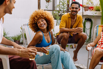 Friends enjoying each other in a rooftop setting during summertime in rio
