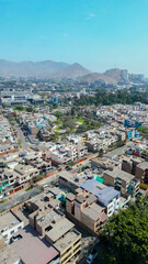 Aerial drone photo of La Molina district featuring green spaces and city layout.