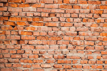 Old red brick wall as a vintage background.