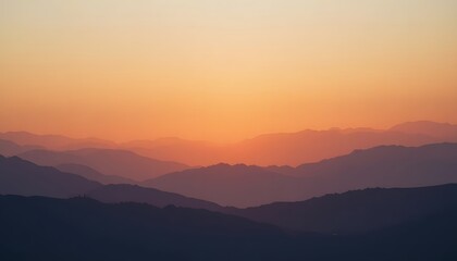 Obraz premium Serene Sunset Over Mountain Range with Gentle Gradient Colors