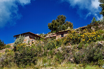 The landscape and farmhouses on Taquile Island in Lake Titicaca, Peru
