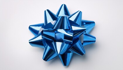a blue metallic star shaped gift bow against a white background