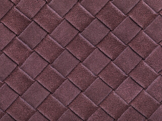 Brown texture of interwoven suede leather forming a square abstract shape