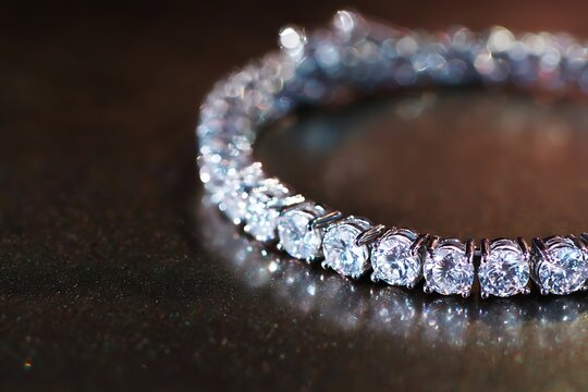 A close-up shot of a sparkling diamond tennis bracelet, exuding elegance and luxury, perfect for fashion or jewelry-related content.