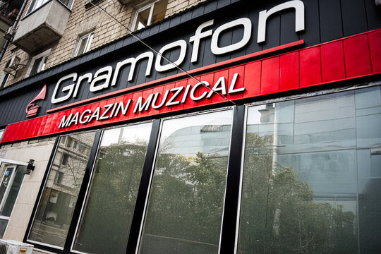 Music storefront in Chisinau Moldova with Gramofon sign and musical imagery on display