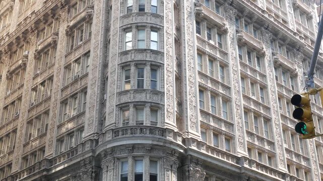 New York City Manhattan Midtown historic building 1909, facade architecture, United States of America. Real estate property on 7 seventh avenue. Classic style design landmark. Corner symmetry, windows