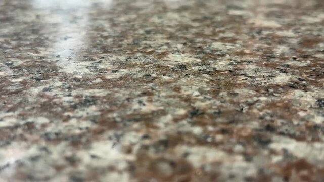Blurred granite texture suitable for backgrounds with emphasis on natural stone pattern