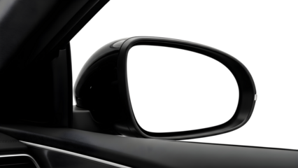 A close up view of a car s side mirror reflecting a bright white background