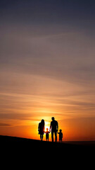Fototapeta premium Family walking together on hill at sunset sky