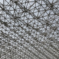 Geometric metal geodesic dome structure against sky architecture d