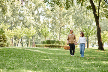Couple enjoying a cheerful spring stroll through a vibrant green park